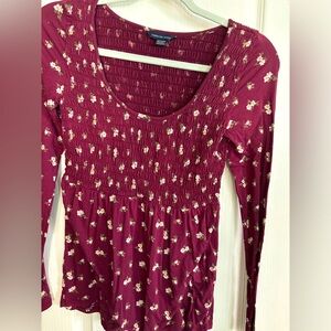 American Eagle long sleeve smocked top. NWOT size XS. True maroon.